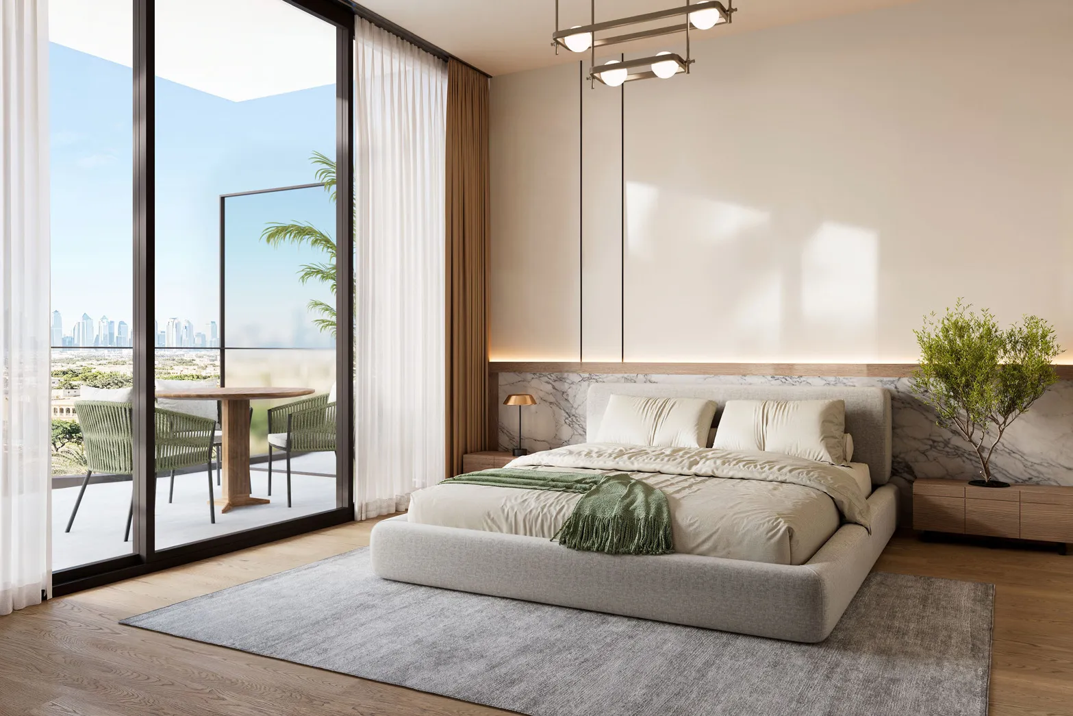 Master bedroom opening onto a balcony with a table and chairs