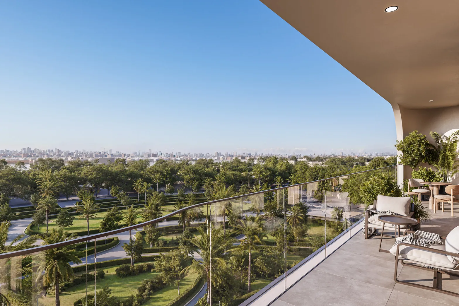 Wide balcony with armchairs overlooking green parkland and the skyline